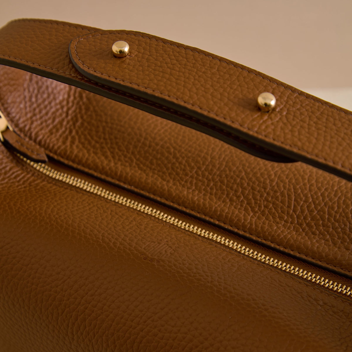 Tumbled grain calfskin